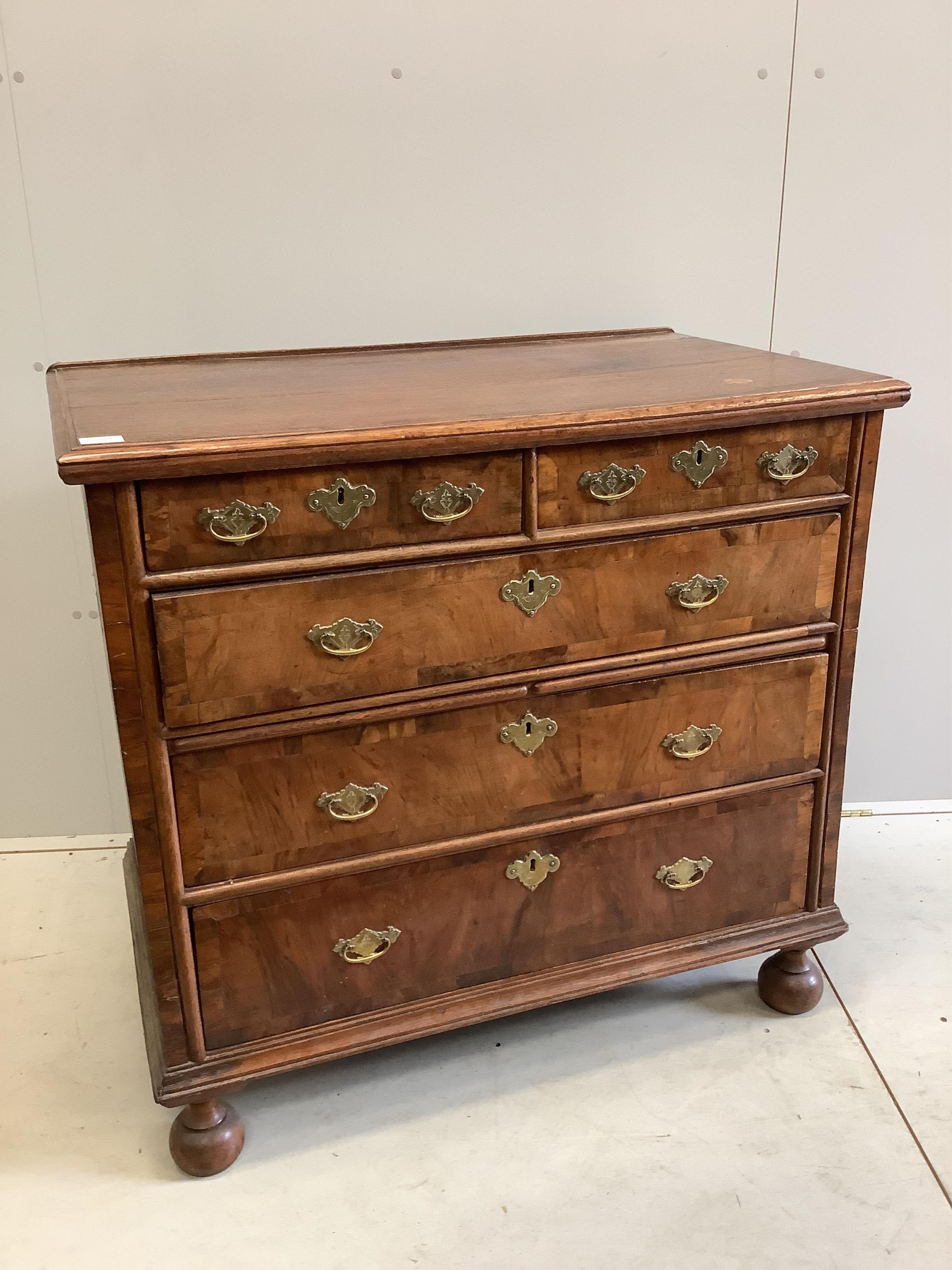 An early 18th century oak and walnut chest, in two sections, width 98cm, depth 58cm, height 93cm. Condition - fair